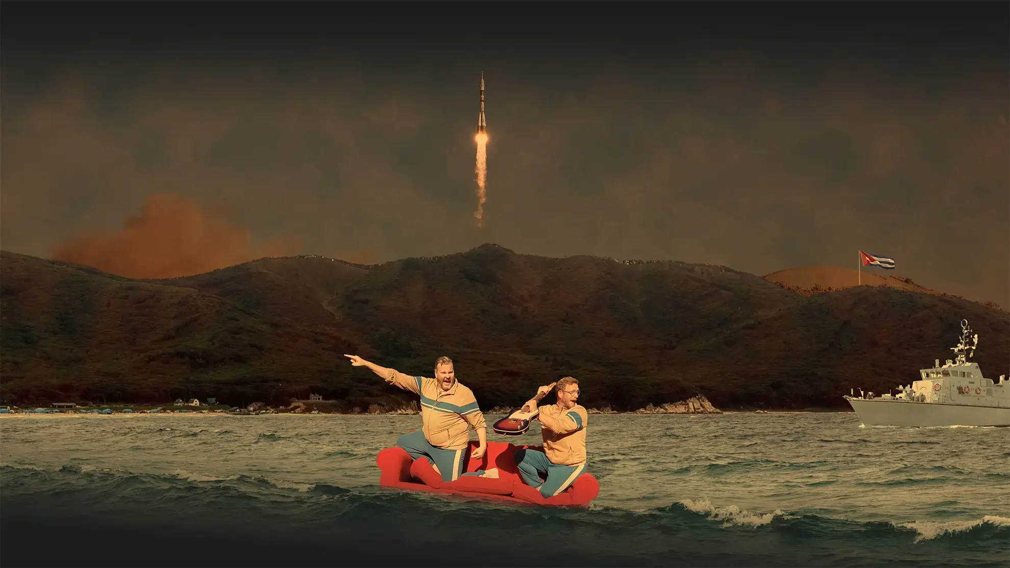 Two men on a red sofa floating in ocean waters with a rocket launching behind mountains